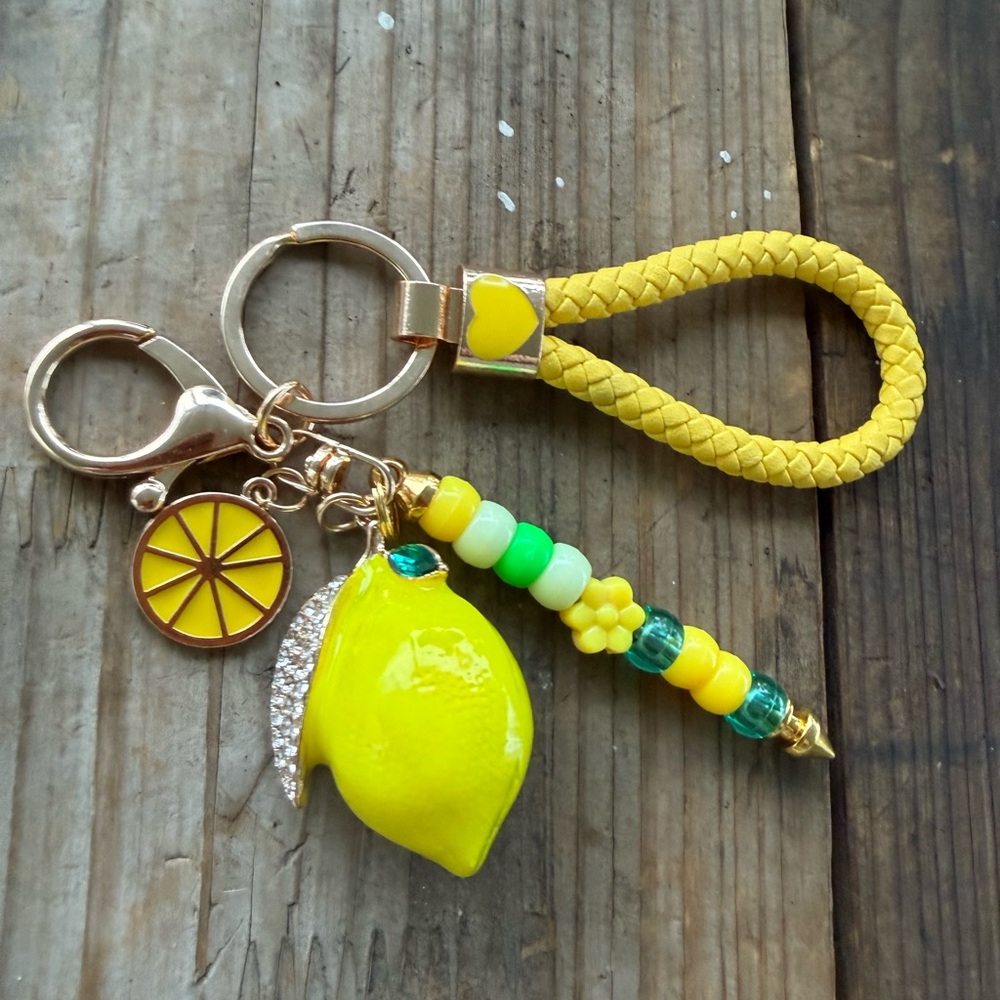 Lemon keychain with green and yellow beads on silver keychain bar.